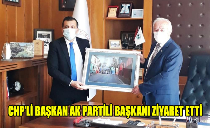 CHP'Lİ BAŞKAN AK PARTİLİ BAŞKAN'I ZİYARET ETTİ