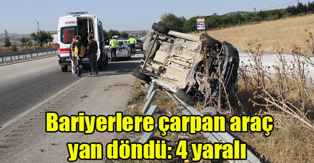 Bariyerlere çarpan araç yan döndü: 4 yaralı